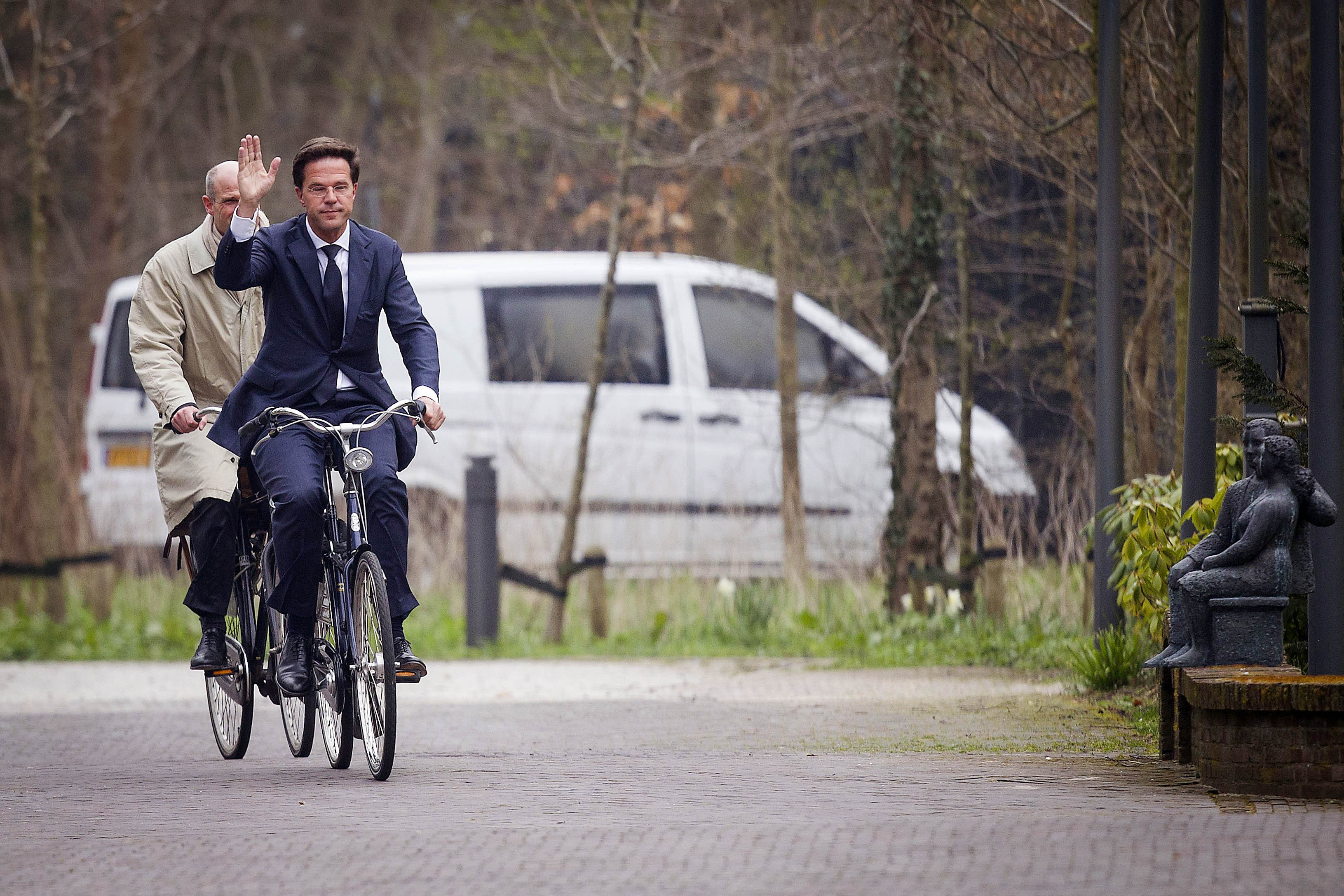 Dutch Prime Minister Mark Rutte (R) and Stef Blok from the People's Party for Freedom and Democracy (VVD) arrive on their bicycles at Catshuis, the official residence of the Prime Minister, in the Hague, on March 29, 2012. AFP PHOTO/ ANP EVERT-JAN DANIELS netherlands out (Photo credit should read Evert-Jan Daniels/AFP/Getty Images)